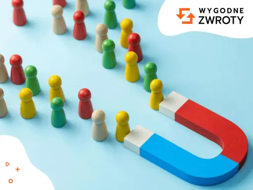 Magnes przyciąga drewniane pionki, symbolizując segmentację klientów i skuteczne docieranie do grup docelowych.